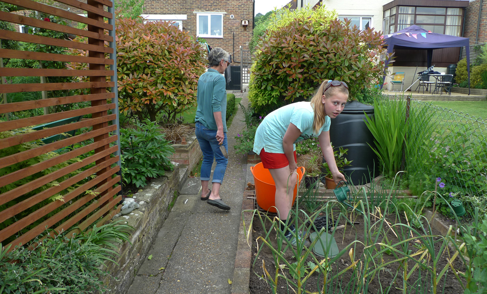 Sunday May 28th (2017) Becky is helping Jude in the garden. width=