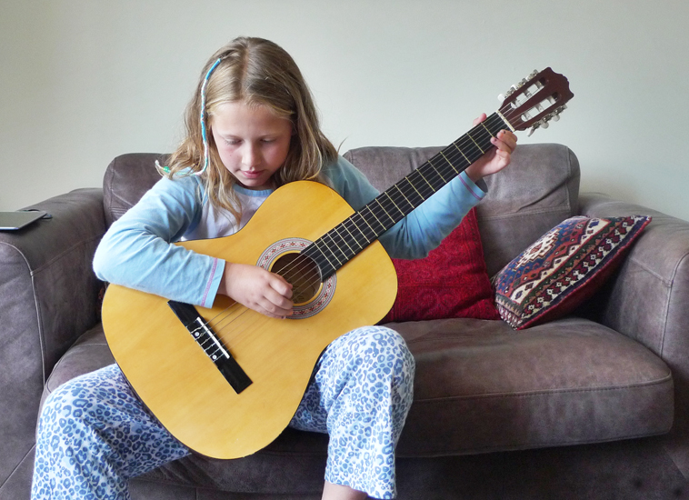 Wednesday July 16th (2014) Rebecca does her guitar practice width=