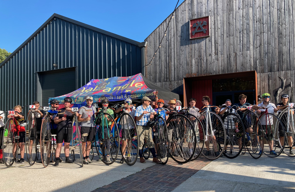 Saturday August 9th (2025) Fourteen penny farthings at the Gun Brewery width=