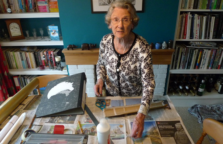 Wednesday April 11th (2018) Laurie working at the dining room table. width=