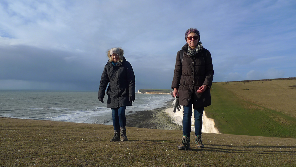Tuesday December 26th (2017) Lyn and Jude approaching the Sarsen's Stone on Flagstaff Point. width=