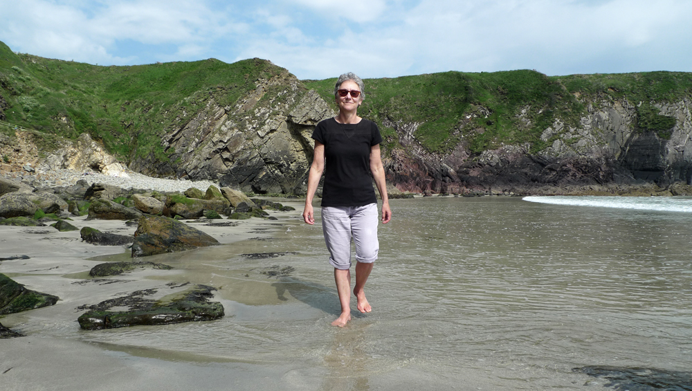 Thursday June 7th (2018) Jude paddles on Caerfai beach. width=