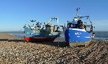 06: Two fishing boats on the beach at Hastings.