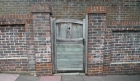This gate gives access to a brick wall.