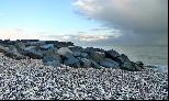 14: Rocks, pebbles and passing storm.